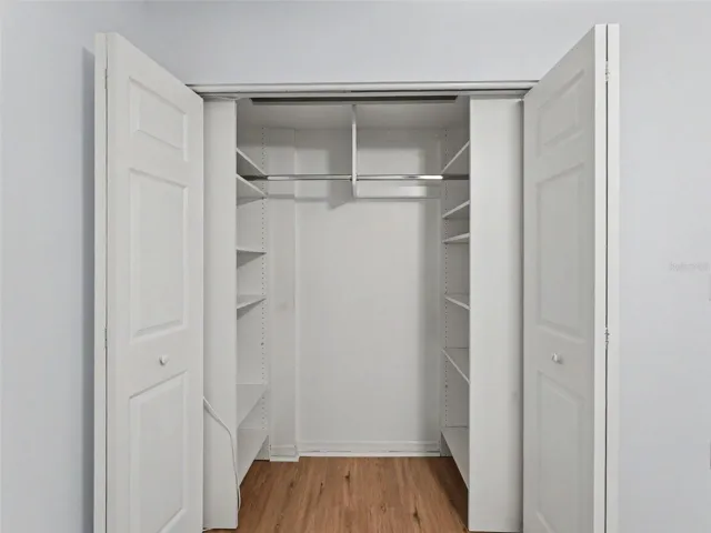 Custom closet organizers in both bedrooms