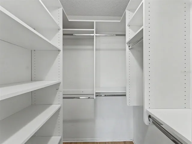 Custom closet organizers in both bedrooms