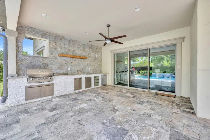 Summer kitchen with gas grill, double burners, & mini fridge