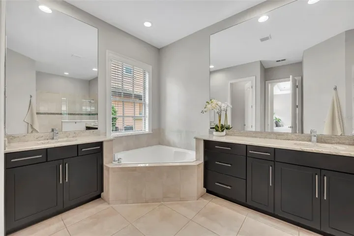 Primary bath with split vanities & garden tub