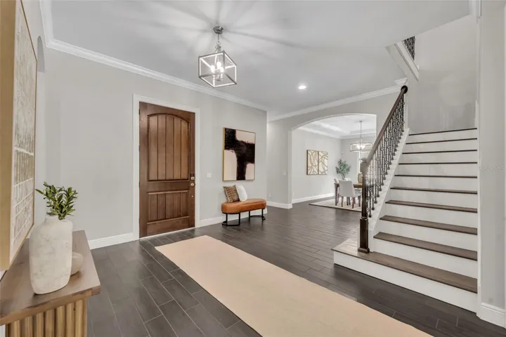 Foyer area- with large storage closet under the stairs