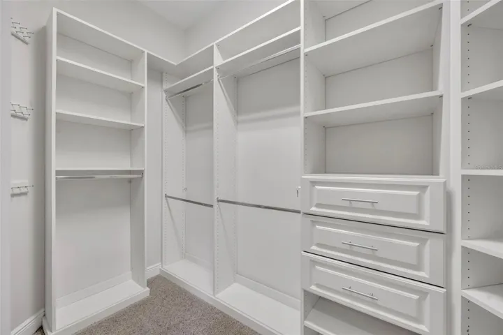 Primary bedroom- 1 of 2 walk-in closets