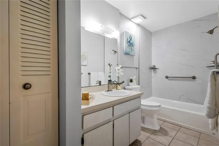 Linen closet/ add stacked washer and dryer unit in the bathroom