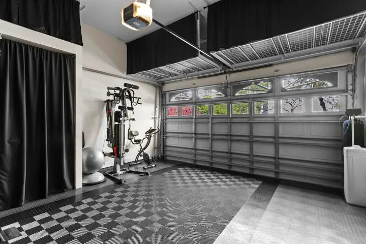Garge with tons of storage and also used as a home gym