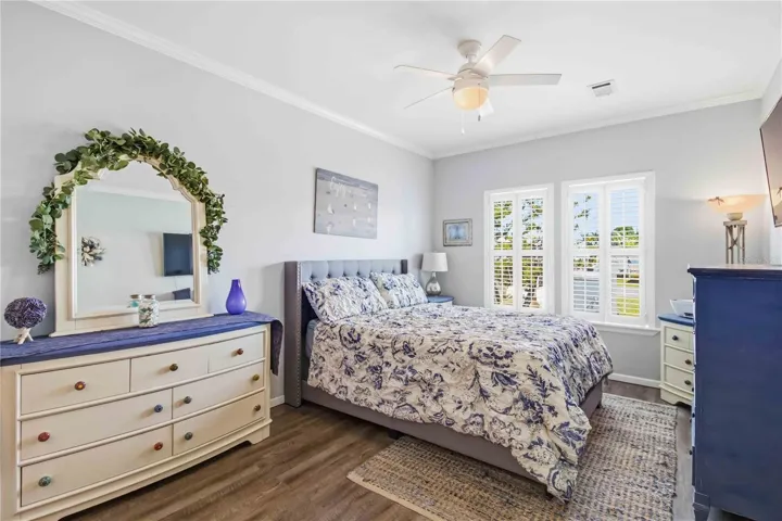 Primary bedroom is large, plenty of room to move around.