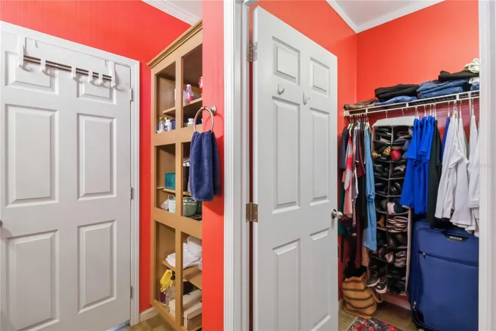 Additional storage behind bathroom door, next to large walk in closet.