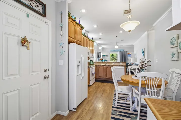 Broom closet on left, water heater located within.