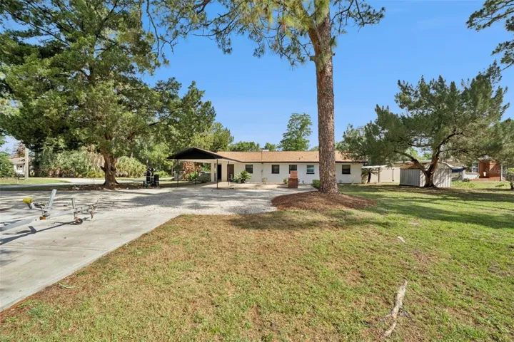 Large driveway to carport