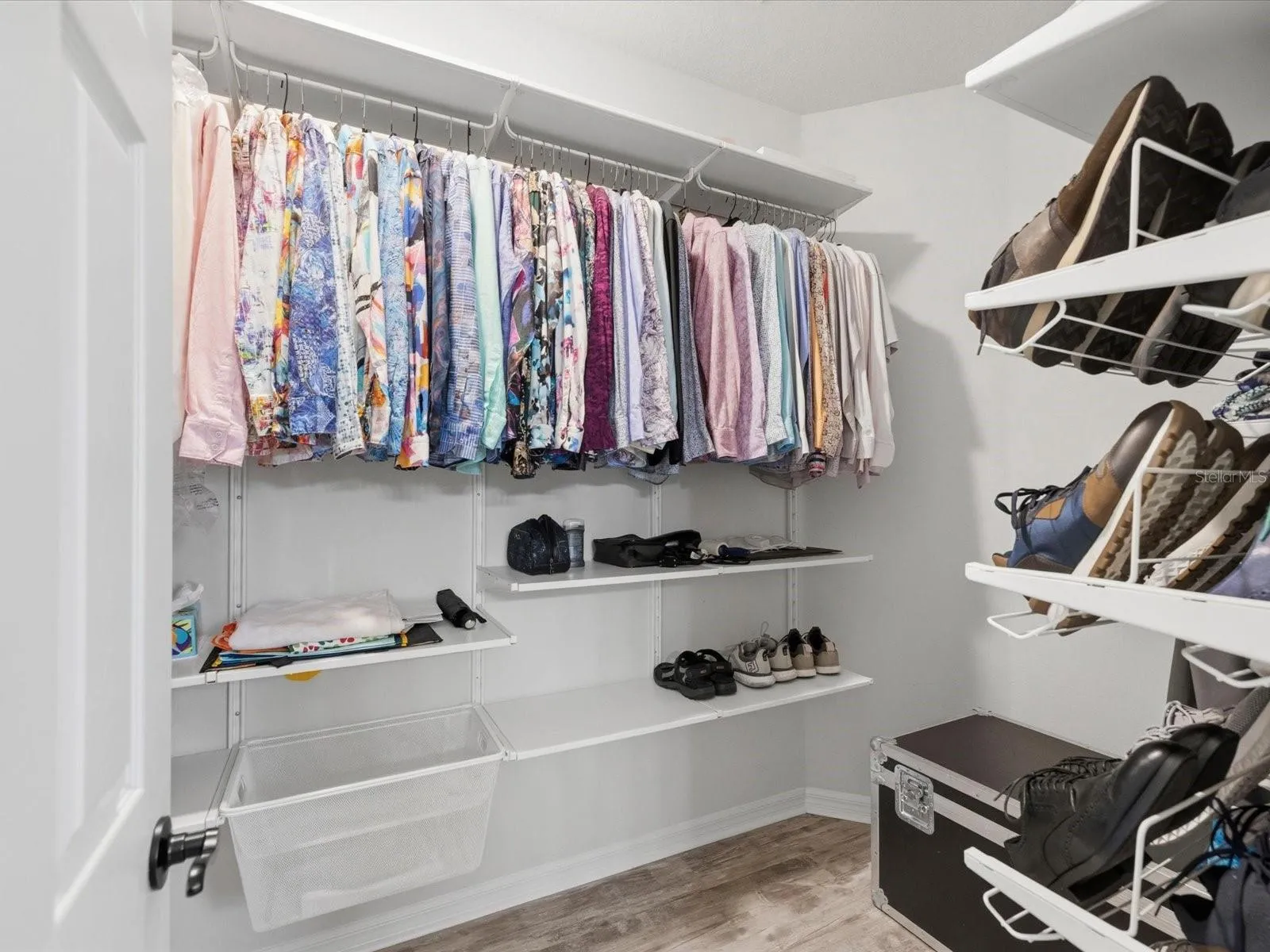 Primary bedroom walk in closet