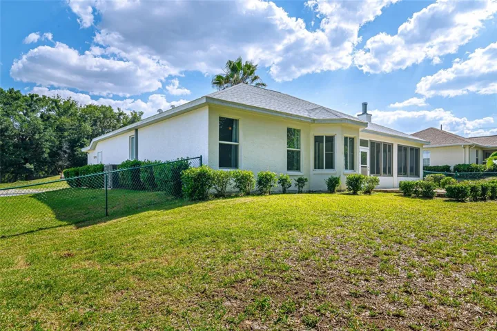 Back Side view of house.  Please notice the bay windows.