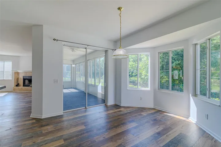 Dining room area with bay windows and view of private backyard and Florida room.