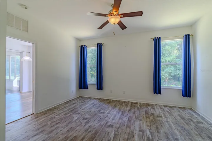 Master bedroom with separate window with view of the private backyard.
