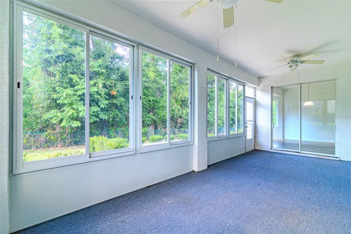 Florida room with acrylic windows and view of the private backyard