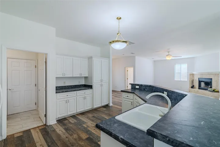 Upgraded cabinets with large pantry and center work area with view of the living and dining rooms.