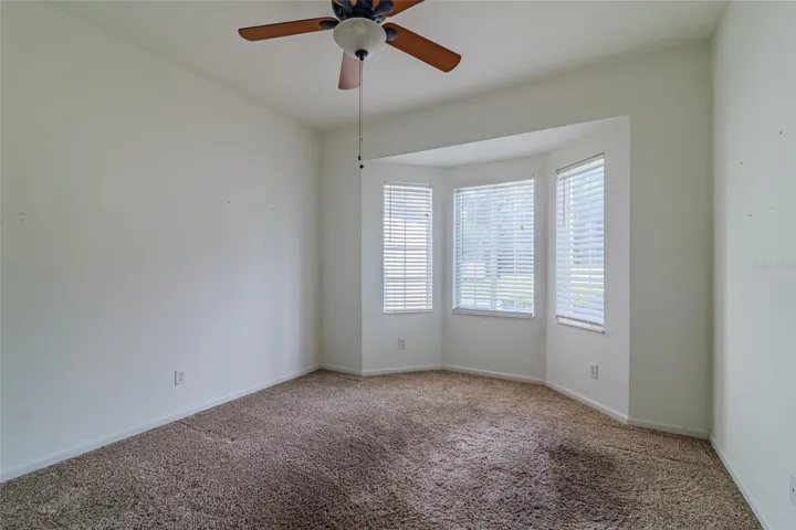 Second Bedroom - It has a bay window and a ceiling fan with light fixture