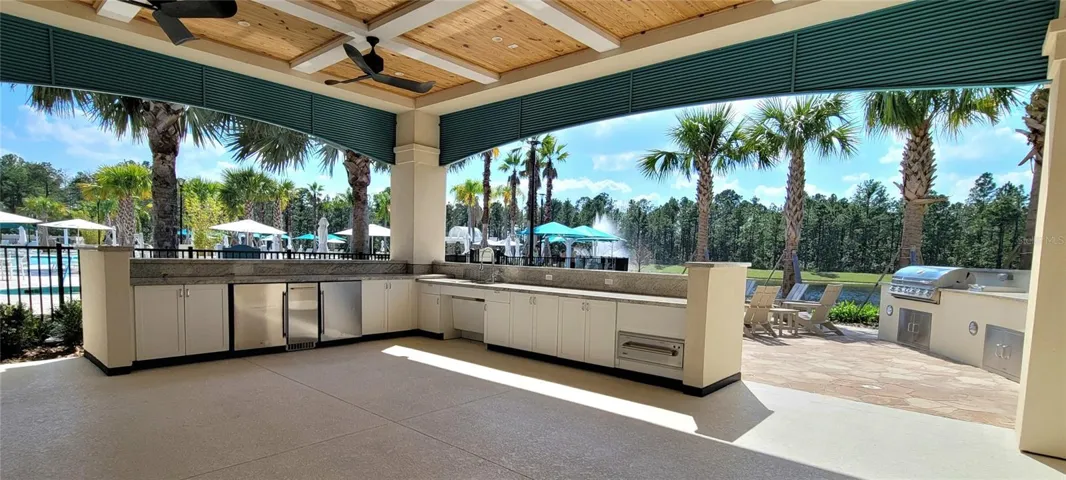 Grills for residents withgas firpit overlooking water