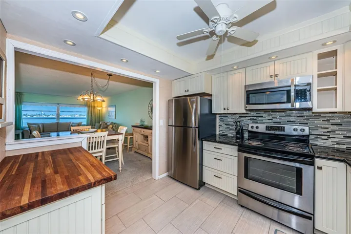 Open kitchen with stainless steel appliances
