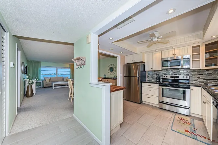 Open and updated kitchen with stainless steel appliances