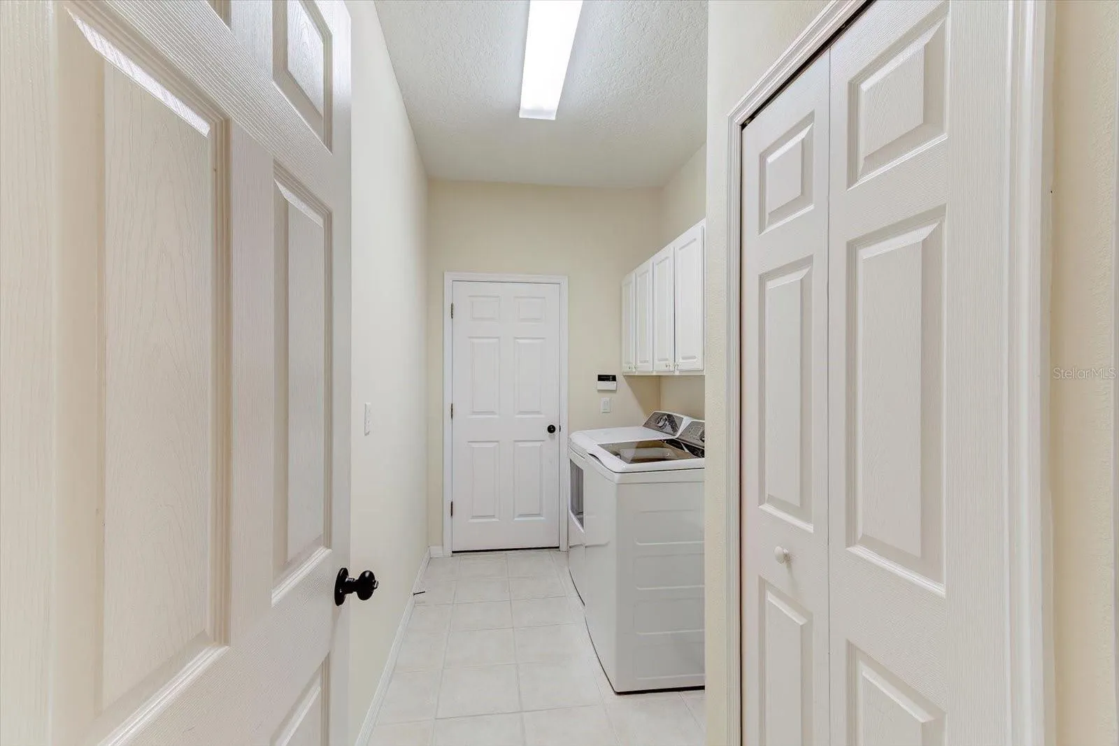 Laundry room with newer washer and dryer