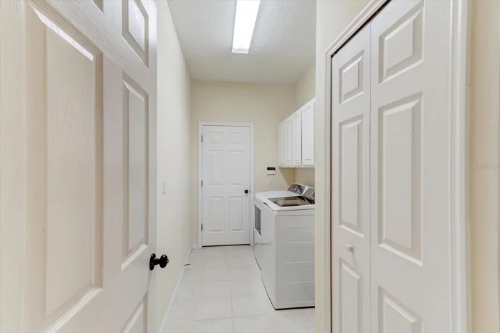 Laundry room with newer washer and dryer