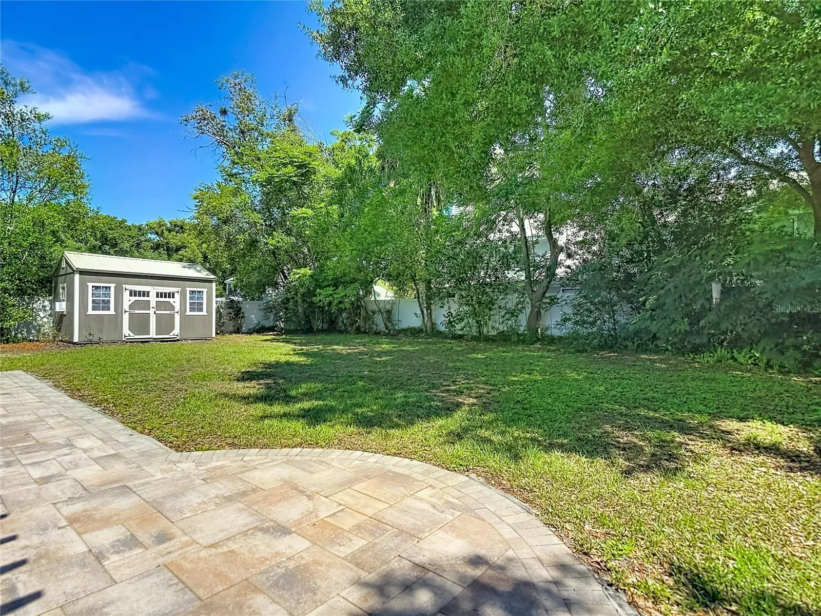 Pavered Patio overlooks this huge backyard-room for a pool and more!