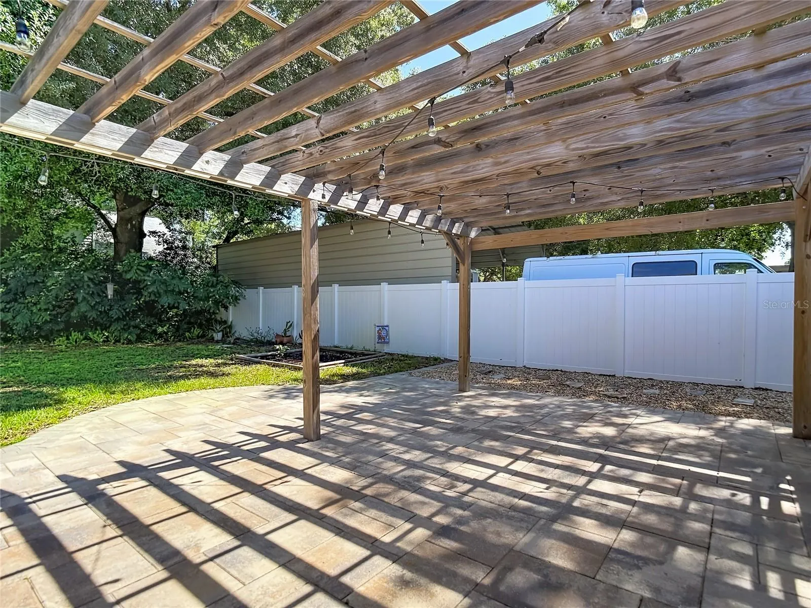 Privacy Fence and mature landscaping encompass the yard