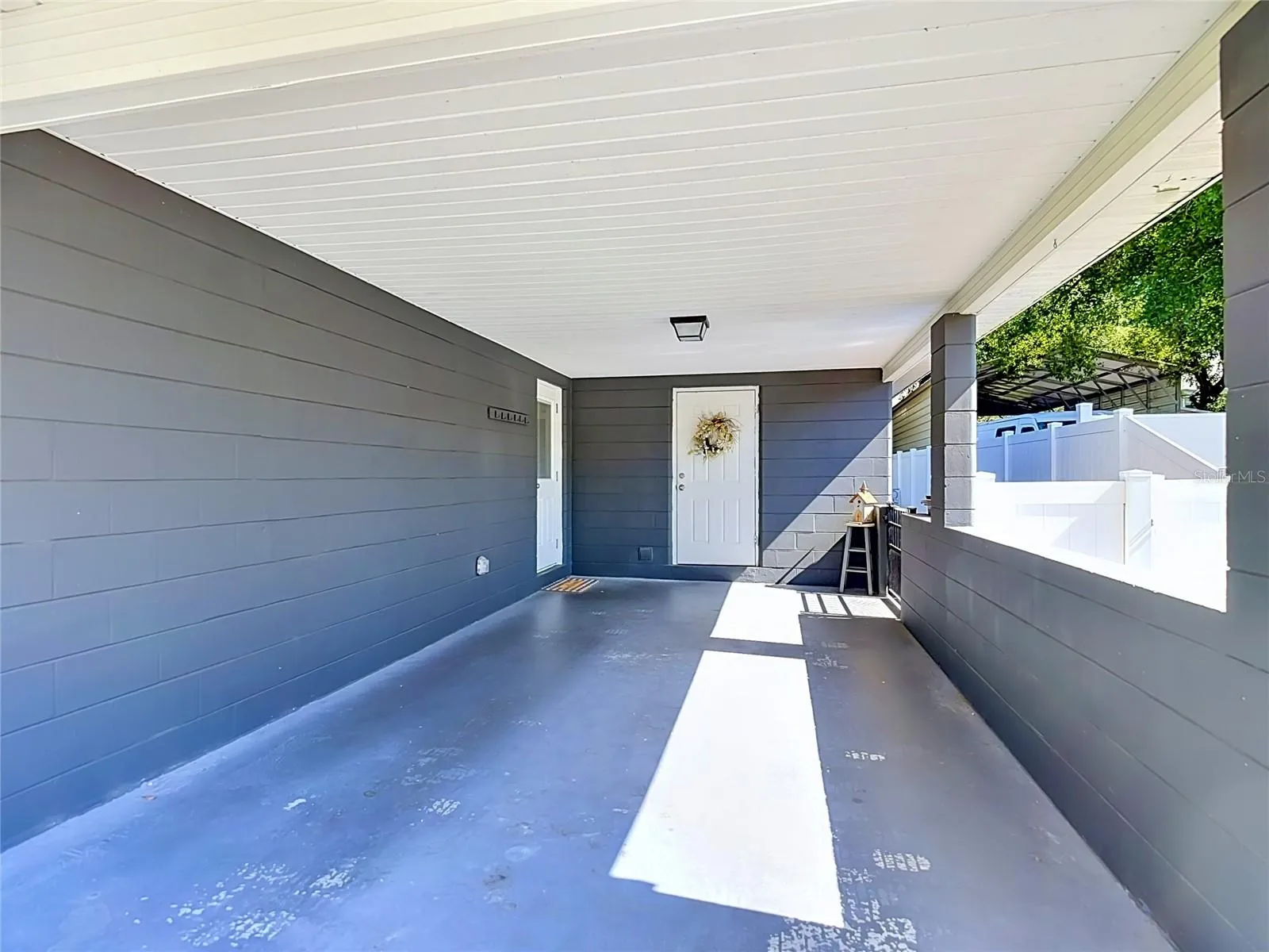 Covered CarPort with Storage Room-Leads to Kitchen Entrance