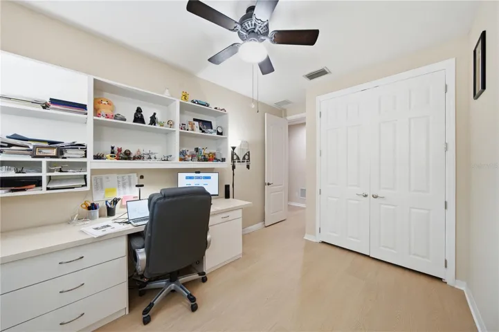 Bedroom 3 with brand new vinyl flooring is currently being used as an office