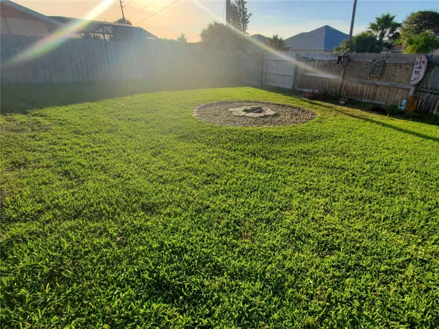Backyard is Fully Fenced,, wide and spacious for a variety of outdoor fun! Plus you can enjoy firepit on cooler evenings.