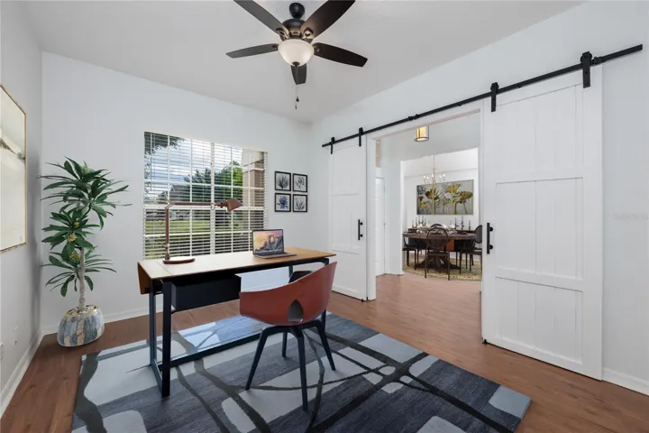 The office with barn doors and dining room flank the front door.