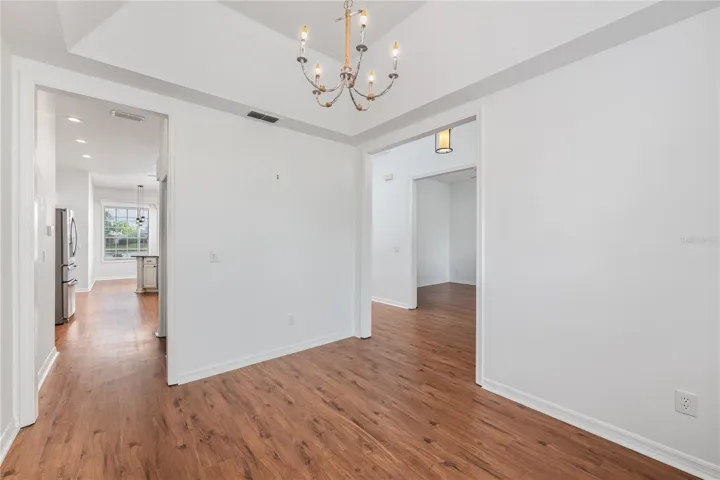 The spacious dining room seamlessly connects to the kitchen.