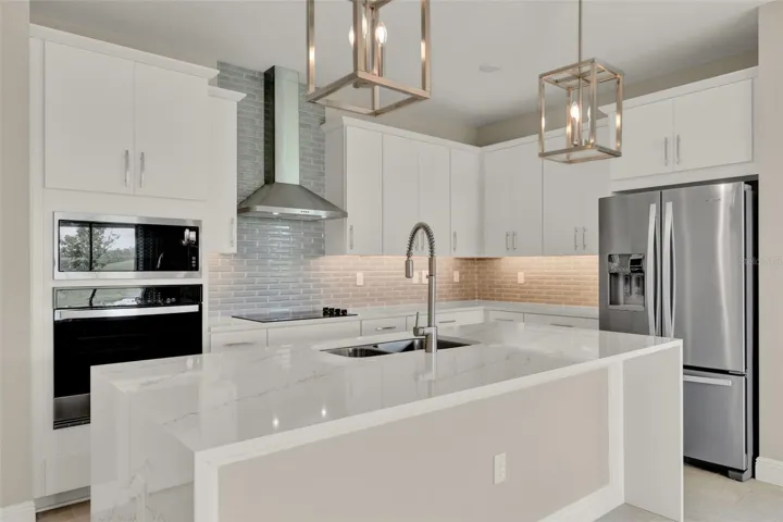 Model Home design - everything upgraded in this GOURMET KITCHEN - ISLAND IS 3 SIDED QUARTZ!
