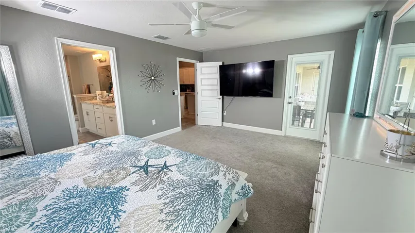 Primary bedroom with direct access to the covered patio