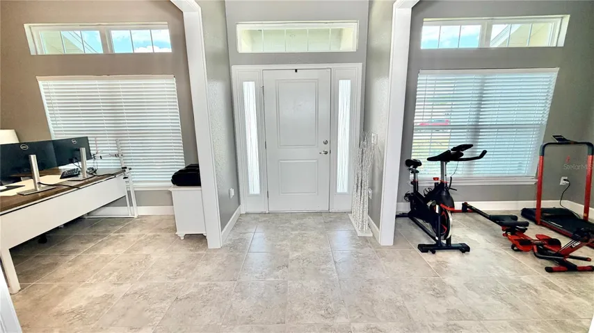 Front door inside flex room R, formal dining room L