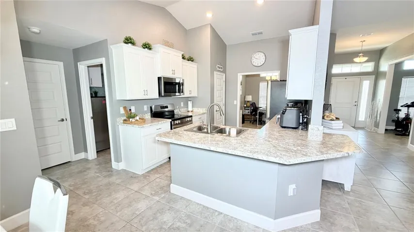 Kitchen view with breakfast bar