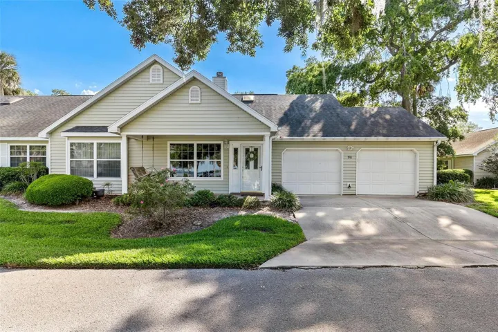 Exterior front of home. Front porch welcomes you giving you lakefront views of Lake Griffin