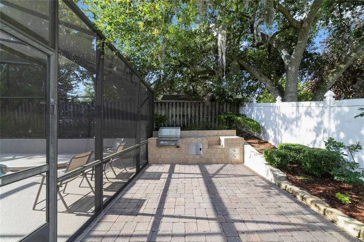 View of summer kitchen and bbq grill area.