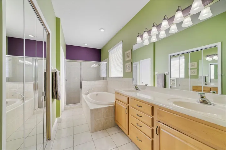 Primary Bathroom with double sinks,soaking tub and walk in shower.