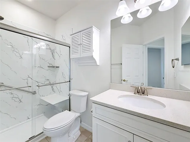 Newly renovated guest bath w/ step in shower & glass door
