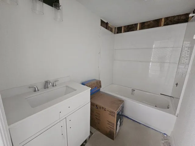 Bath with new vanity, toilet and shower