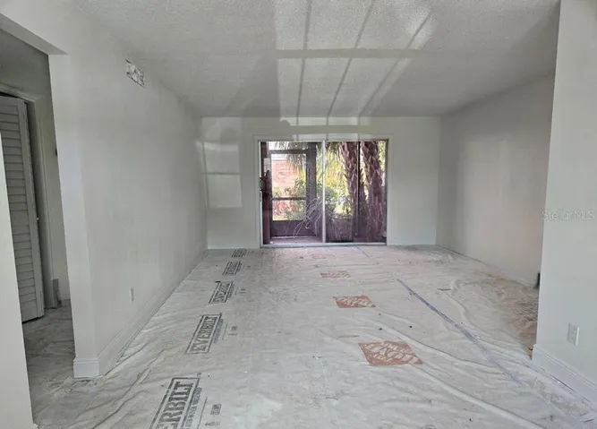 Living/Dining Room with sliders leading to screened porch