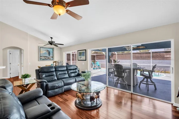 Light & bright main living with triple glass sliders overlooking the pristine pool~