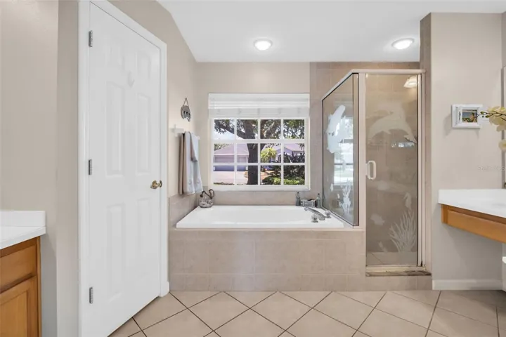 Deep soaking garden tub, separate walk-in shower, & dual vanities~
