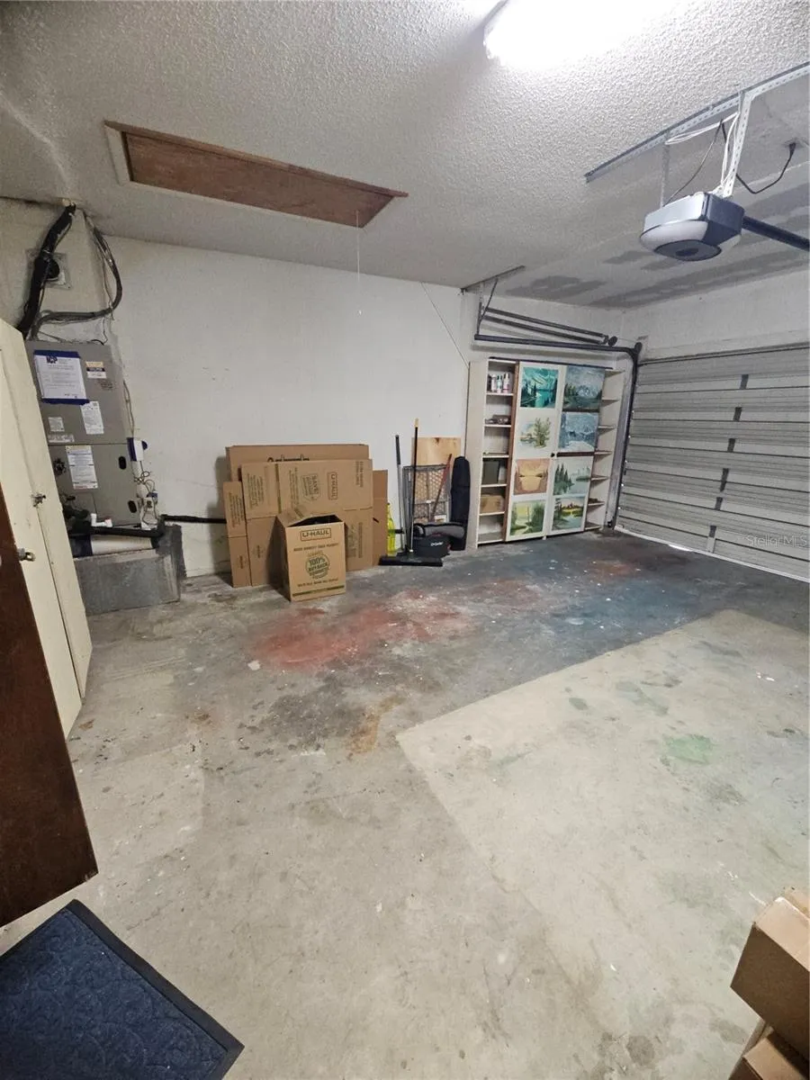 Owners closet in part of garage with room for 1 car parked in garage