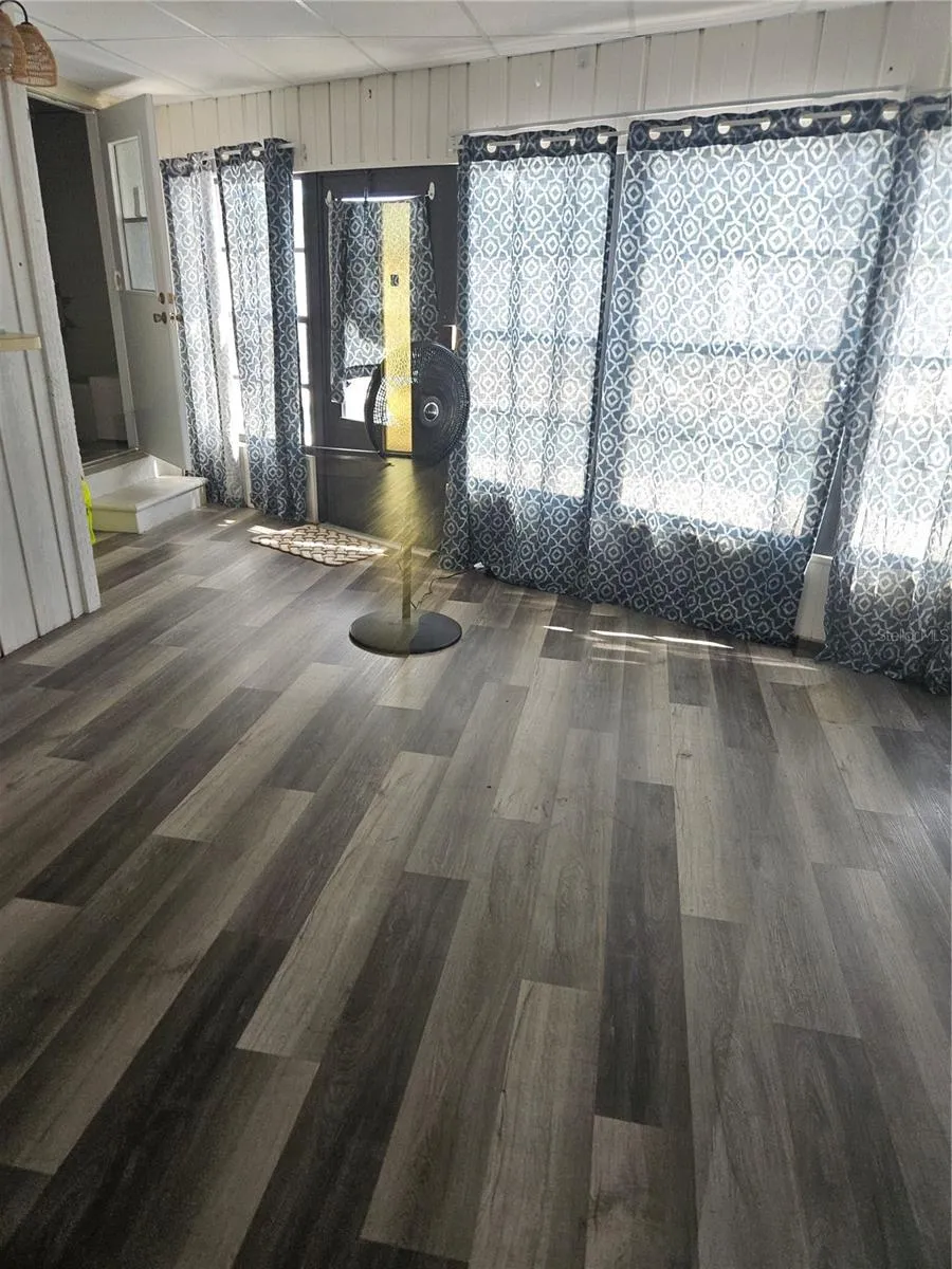 Sunroom with Back door to Pool and door to Guest Bathroom