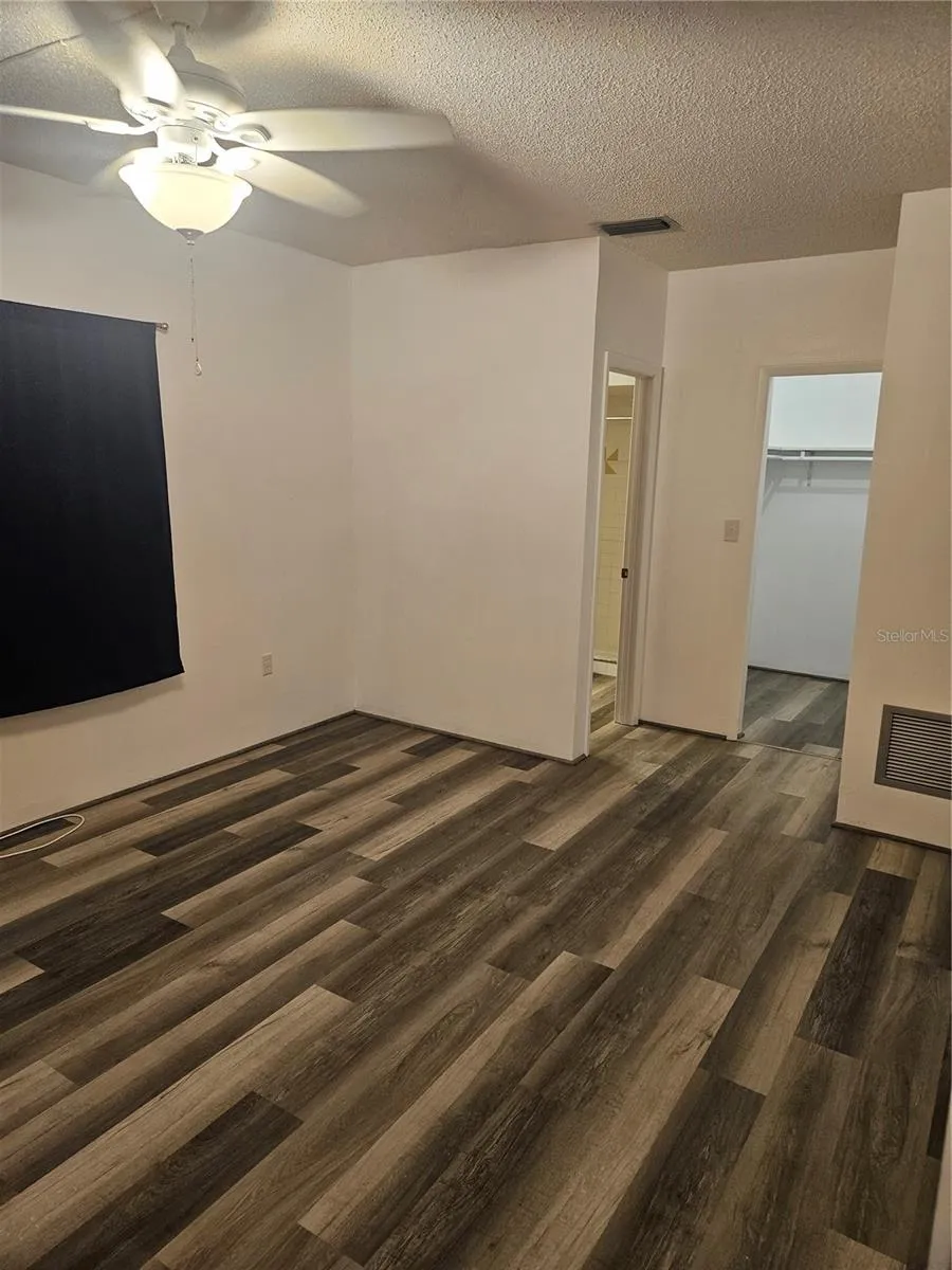 Master Bedroom with Ceiling Fan, Walk In Closet and En Suite Bathroom