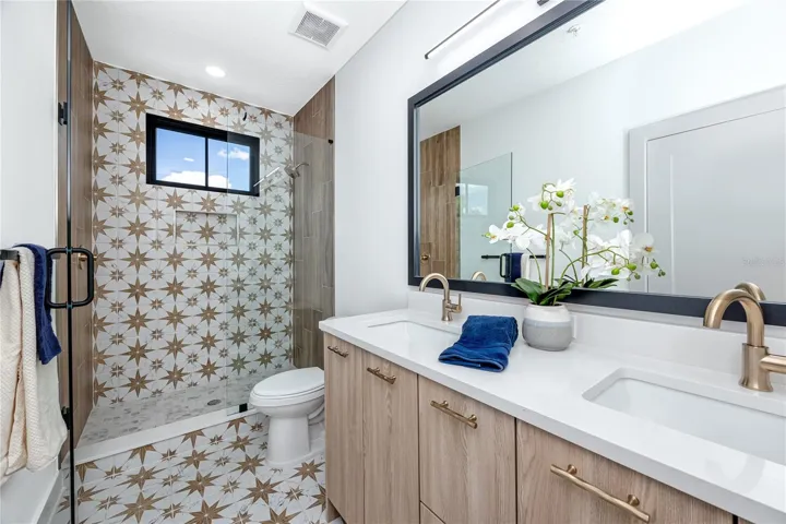 Master Bedroom with Double Vanity and Walk in Shower