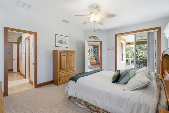Master Bedroom w/ Slider to the Covered, Screened Lanai & Ensuite