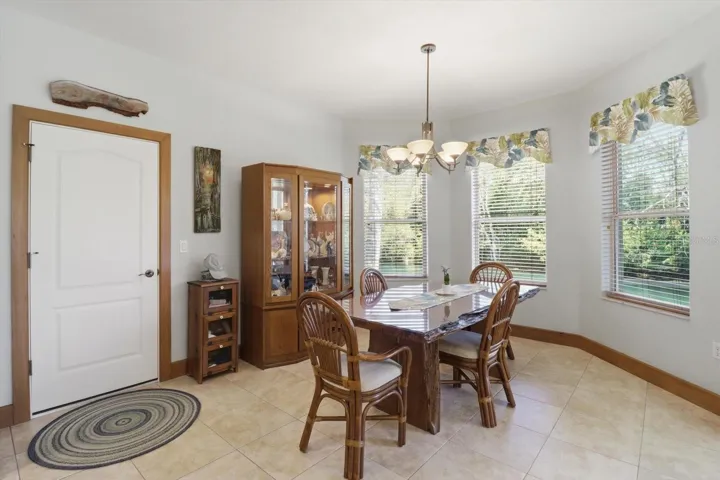 Dining Area Overlooks the Water...Door to Garage on Left