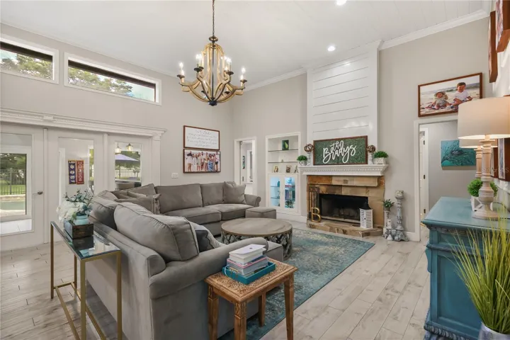 CUSTOM BUILT BOOKSHELF, WOOD BURNING FIRE PLACE, SHIPLAP CEILING